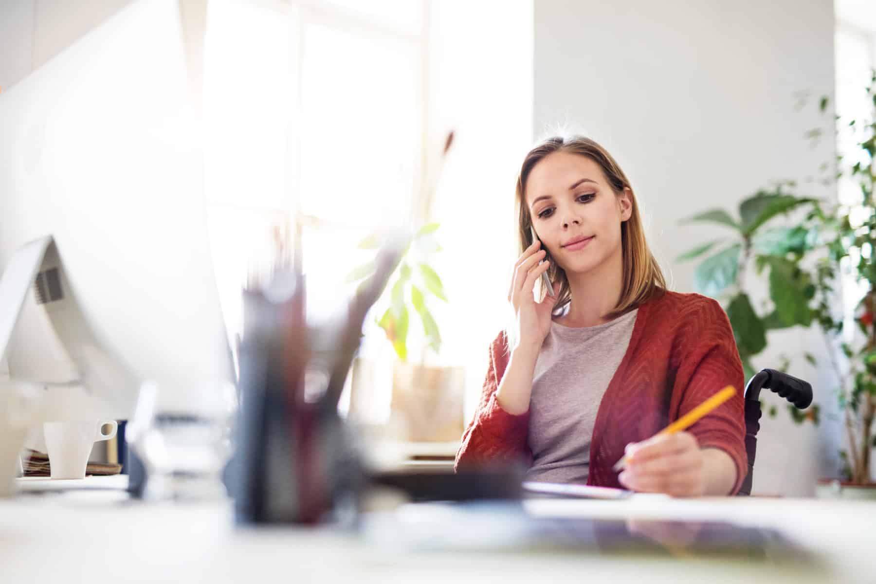 woman calling a social security disability lawyer