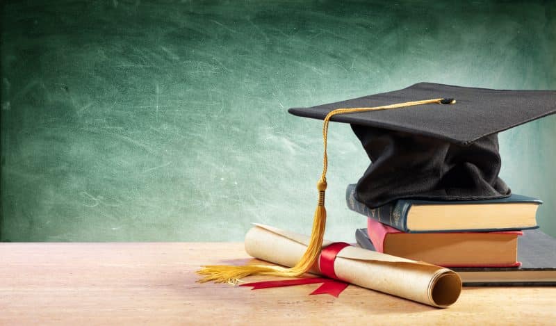 A graduation cap and a diploma.